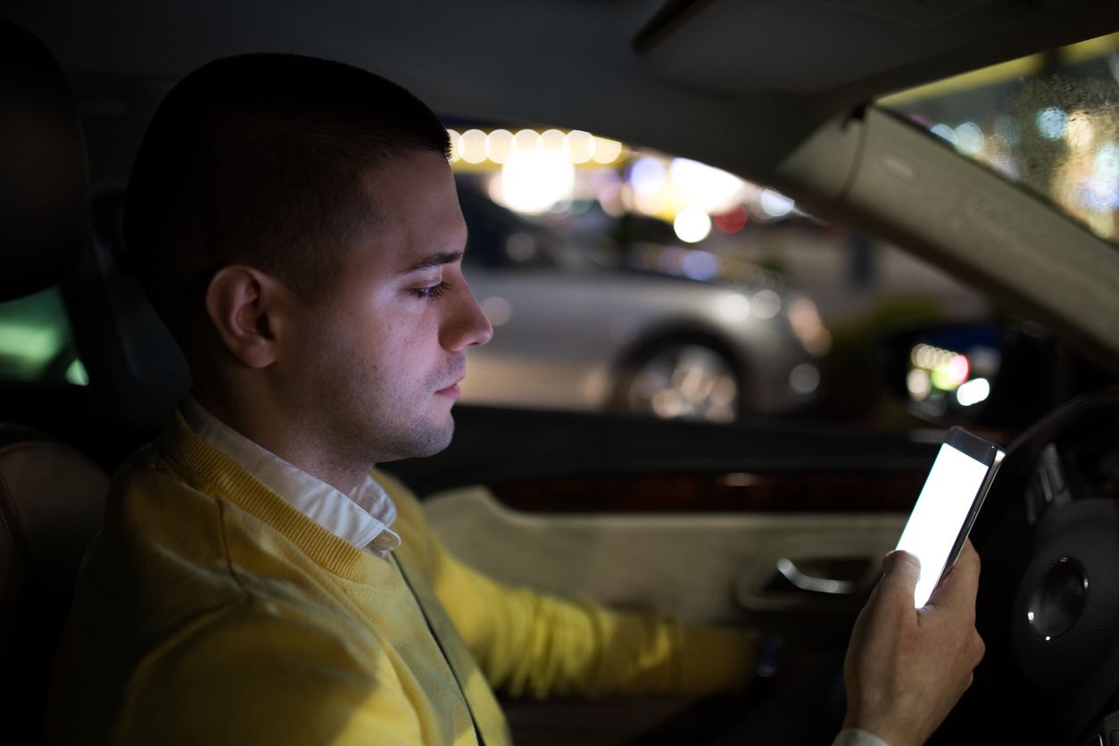 Man texting and driving