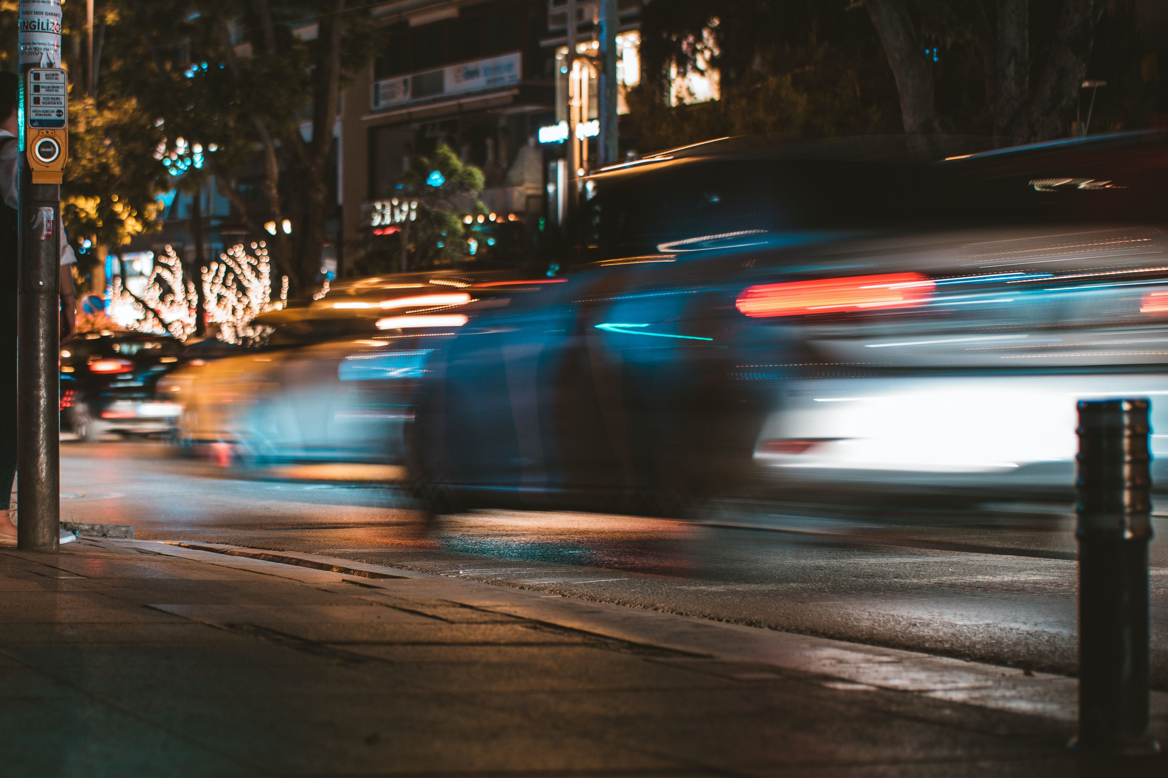 fast moving cars at night on city street