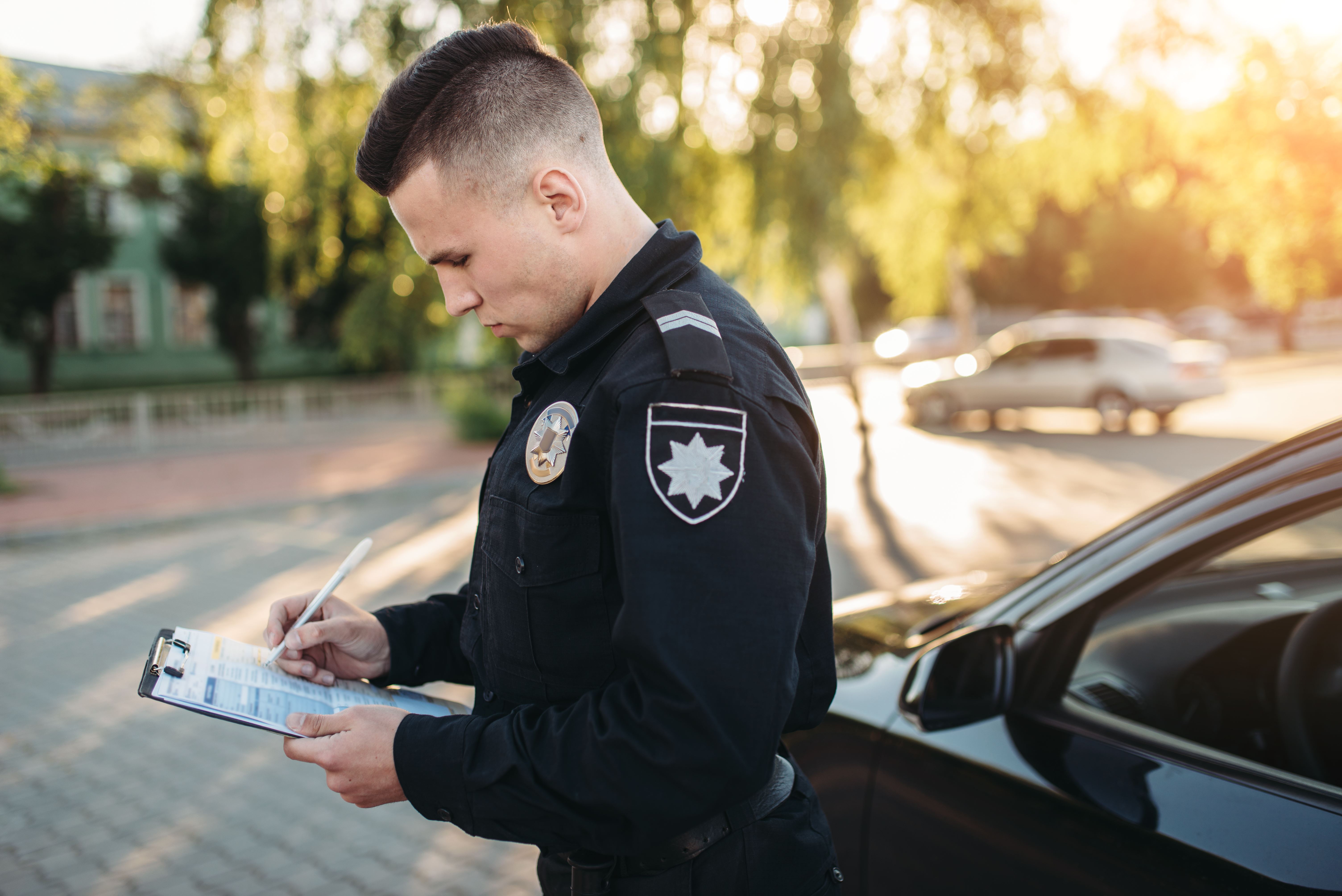 cop writing ticket